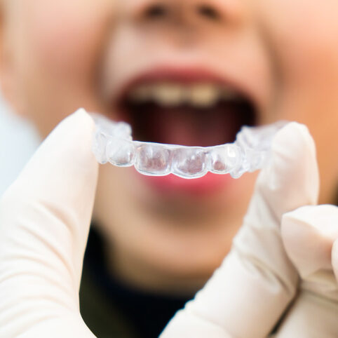 Child receiving Invisalign First® from his orthodontist