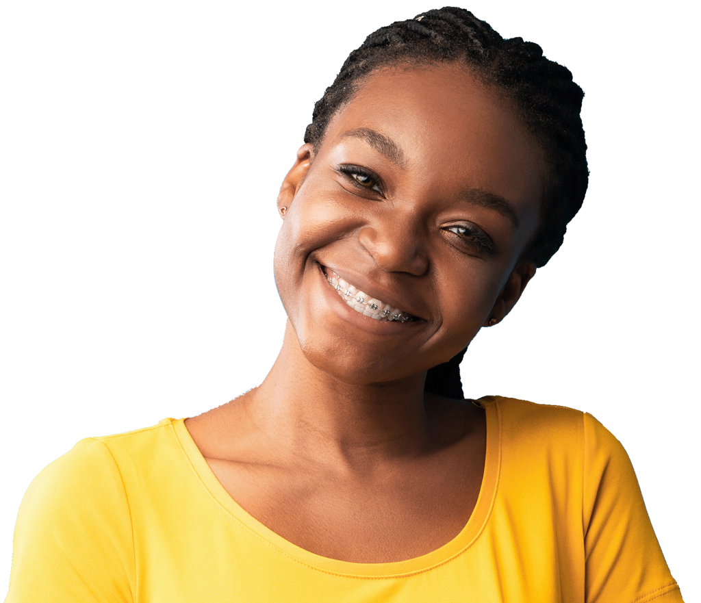 Young woman with silver metal braces in Chesapeake, VA smiling in a sunset colored shirt