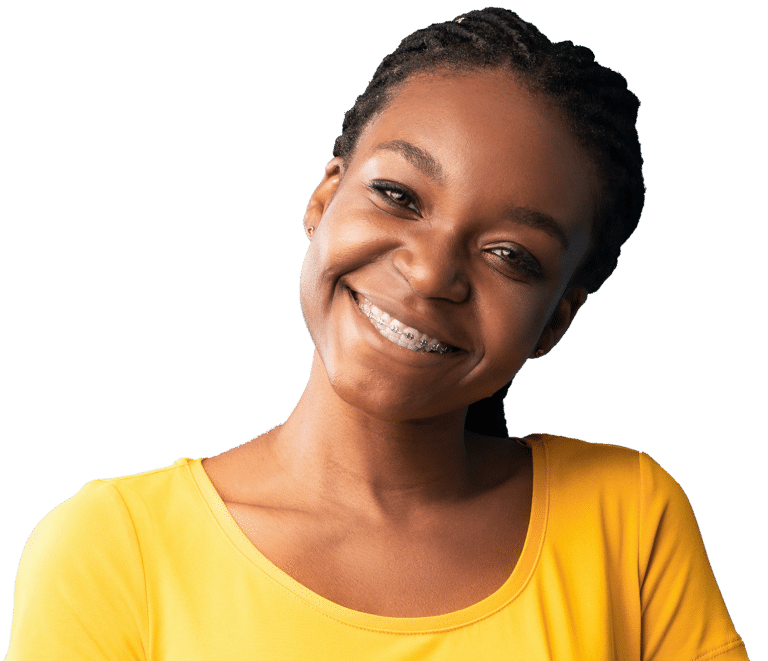 Young woman with silver metal braces in Chesapeake, VA smiling in a sunset colored shirt