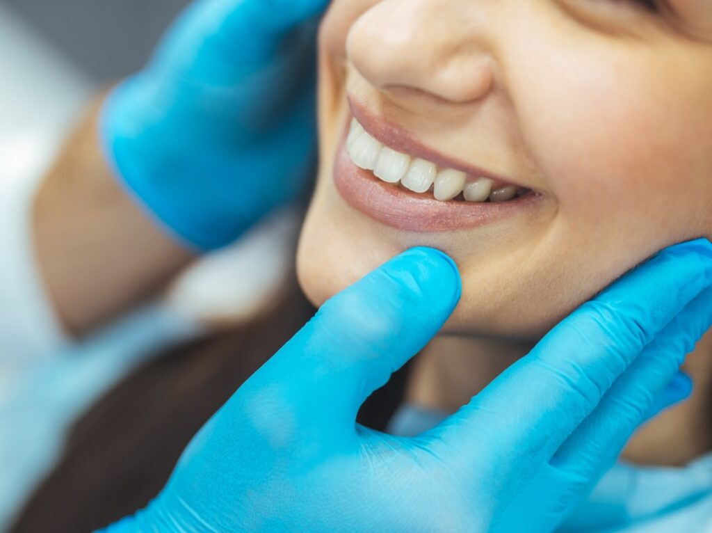 Woman with a relieved smile after receiving emergency orthodontic treatment in Chesapeake, VA